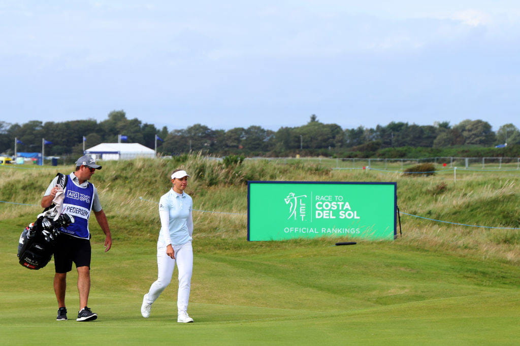 Emily Kristine Pedersen walking with her caddie at the AIG Women's Open